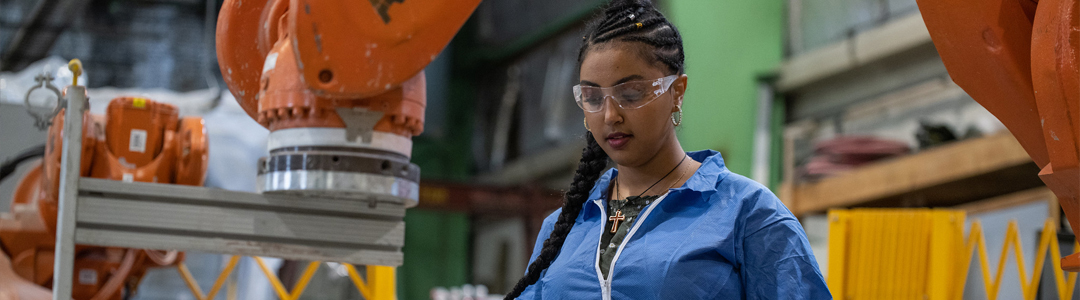 A person wearing glasses works in a lab